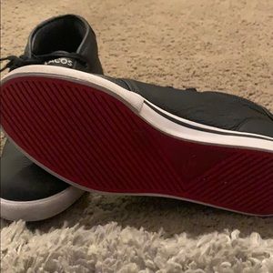 Barely worn red bottom Lacoste sneakers.